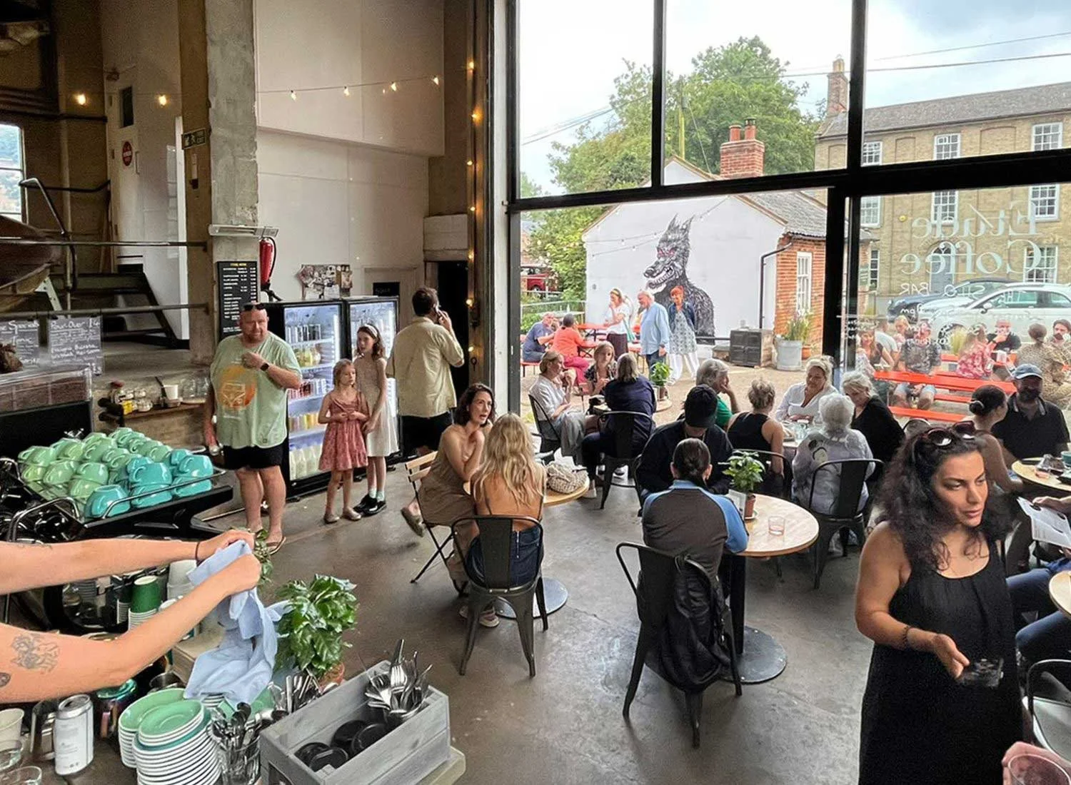 A busy morning in The Silo cafe, with the river outside
