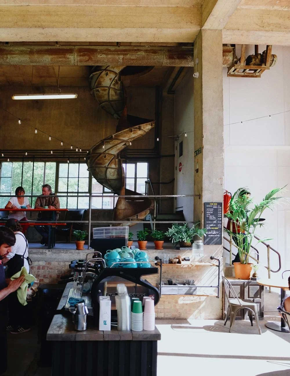Inside The Silo cafe with its concrete columns and spiral slide
