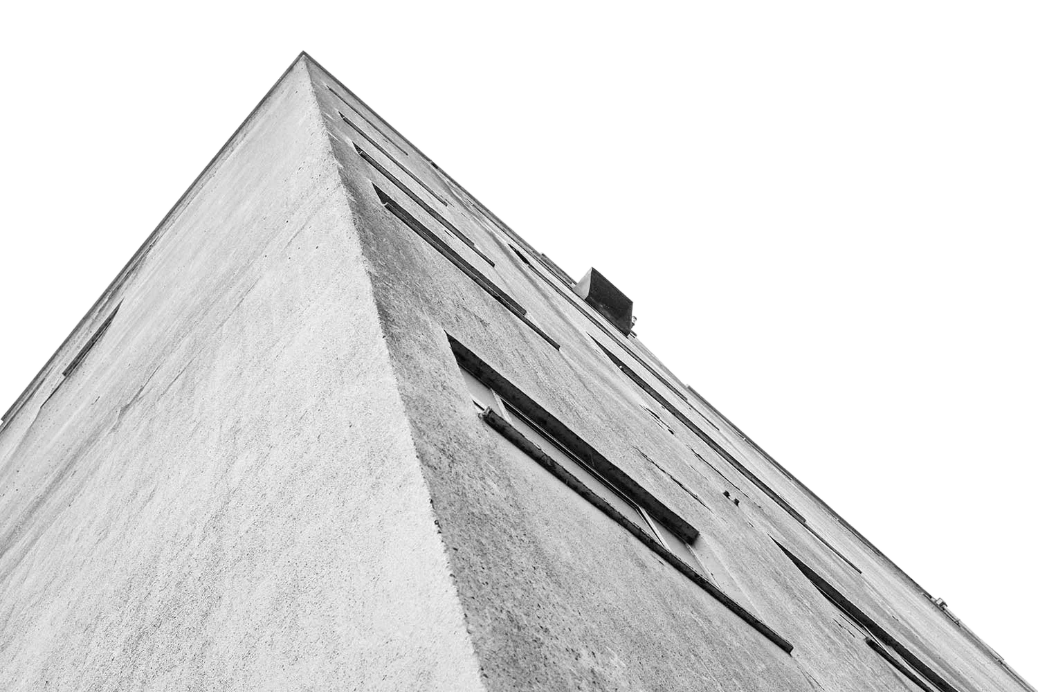 Low-angle black and white view of The Silo's concrete corner